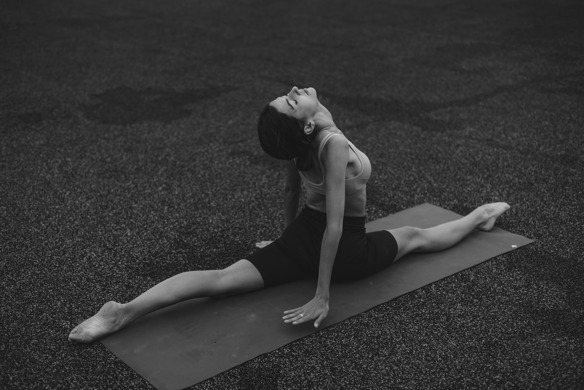 a woman doing front split